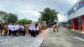 Aparatur Sipil Negara (ASN) dan staf Dinas Perpustakaan dan Kearsipan (Dispusaka) Provinsi Sulawesi Tengah mengikuti apel pagi perdana tahun 2026 di halaman kantor Dispusaka Sulteng, Palu, Senin (12/01/26). FOTO: istimewa